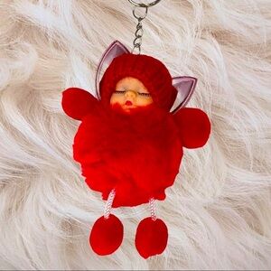 SLEEPY BABY WITH FAIRY WINGS SMALL POMPON IN RED  KEYCHAIN CHARM